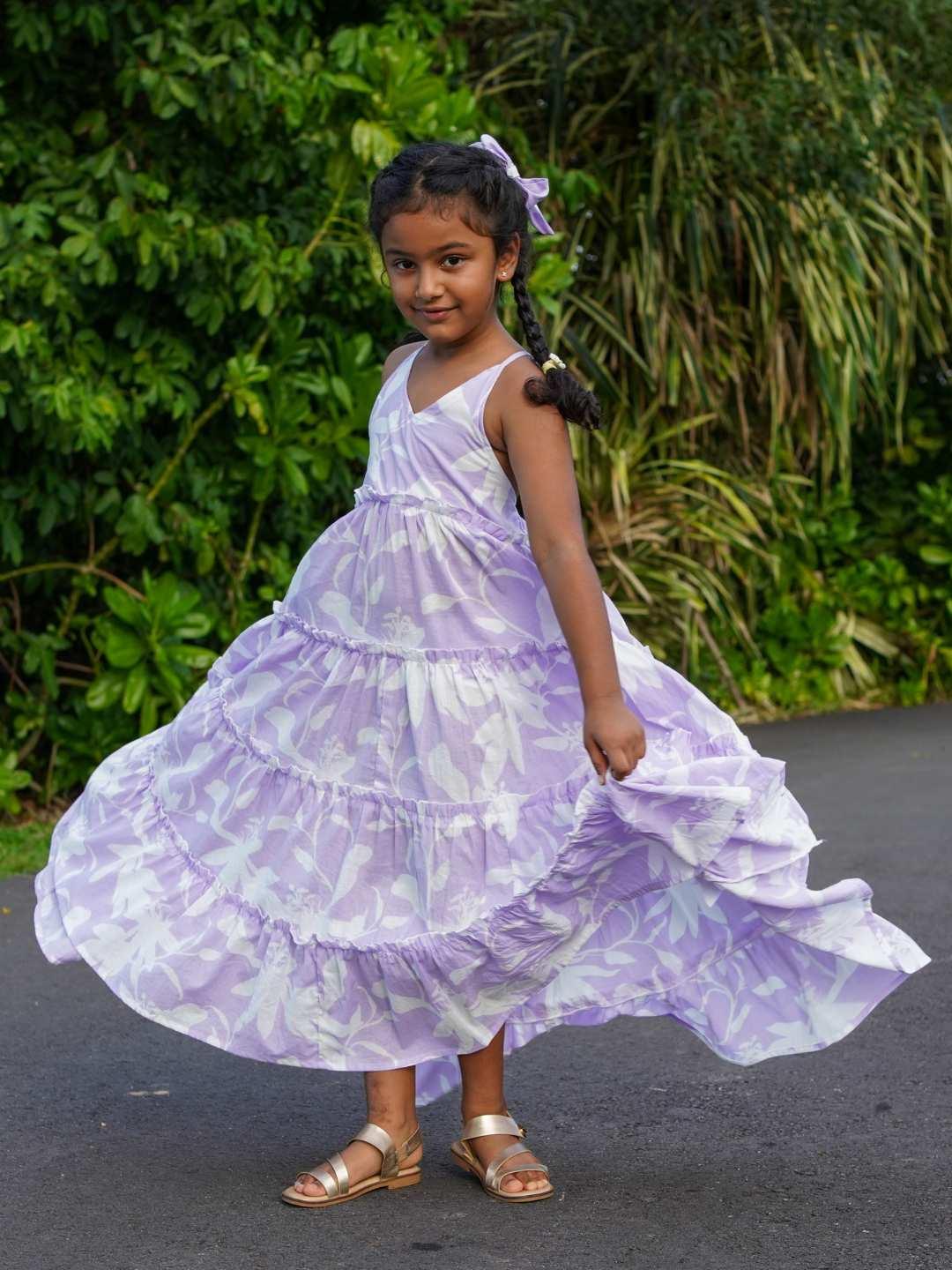Lavender cotton long dress for girls with tiered skirt and ruffled straps, sustainable and casual style.