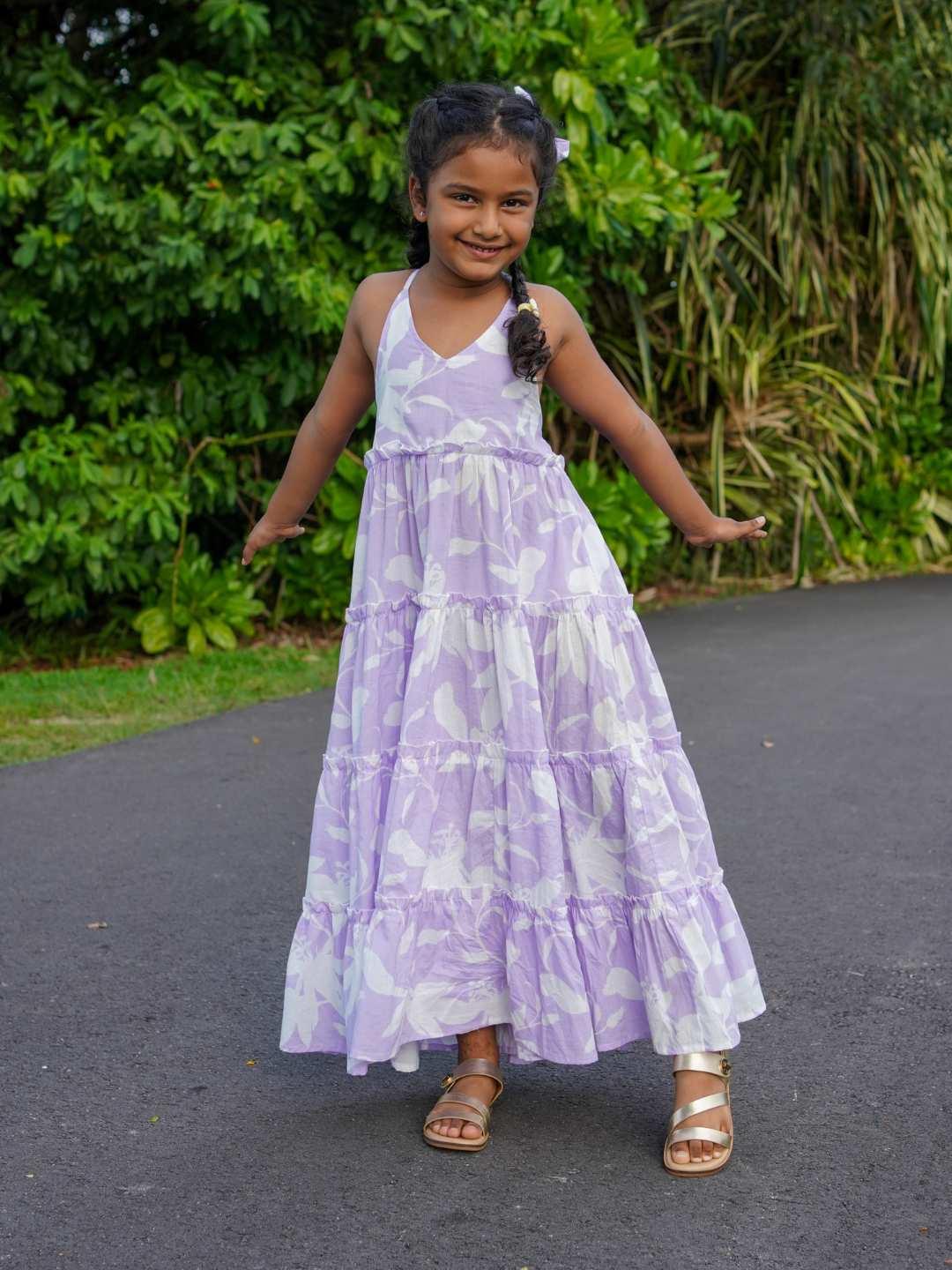 Girls long lavender cotton dress with floral pattern, sleeveless design, and tiered skirt, sustainable fabric.