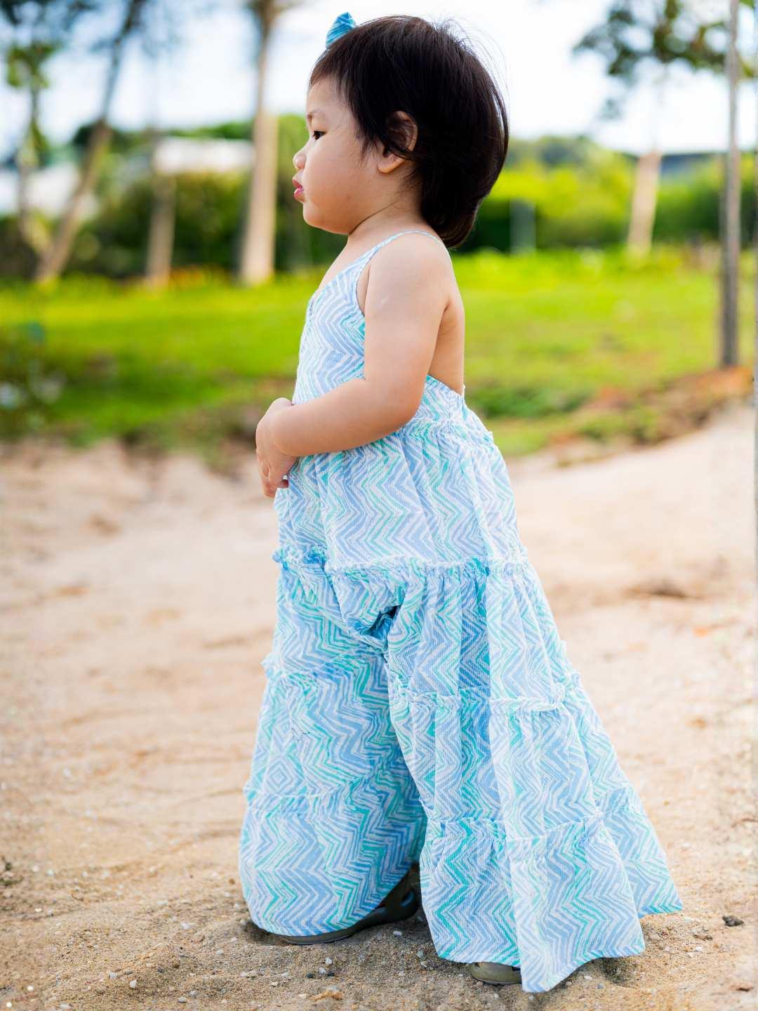 Azure cotton tiered long dress with wave pattern, sleeveless design for toddler girls, sustainable fabric.