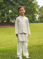 Child wearing a traditional Nimbu outfit ethnic wear